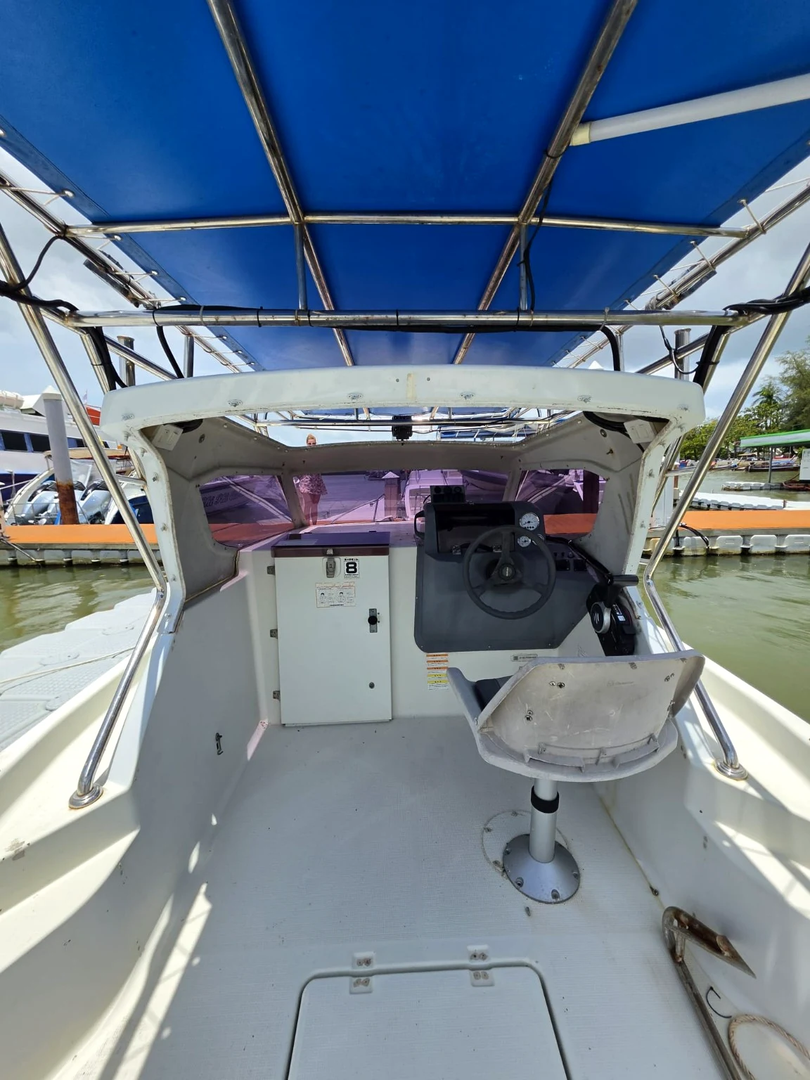 View the sheltered helm, canopy and seating