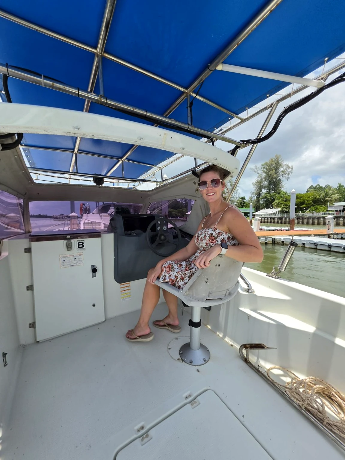 Relaxing at the GF21’s sheltered helm at the marina